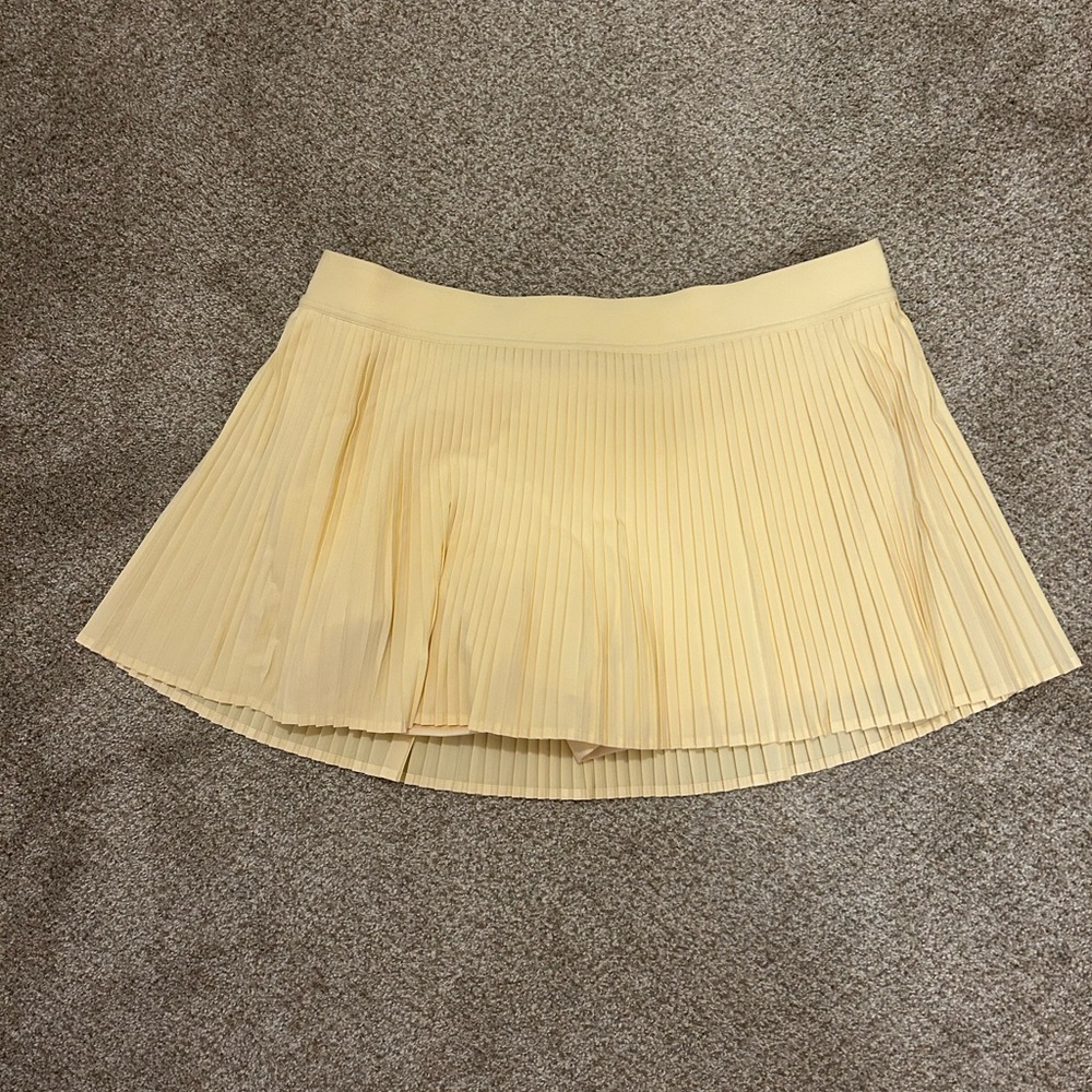 EUC Varsity High-Rise Pleated Mini Skirt in Buttercream